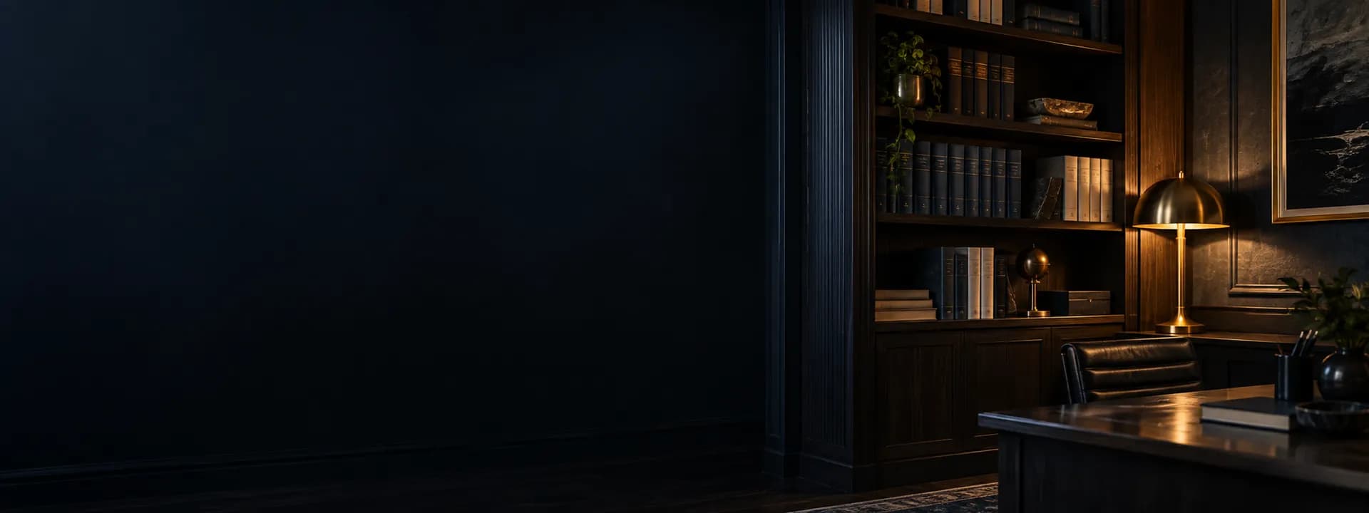 A bookshelf with folders and books next to a lamp switched on